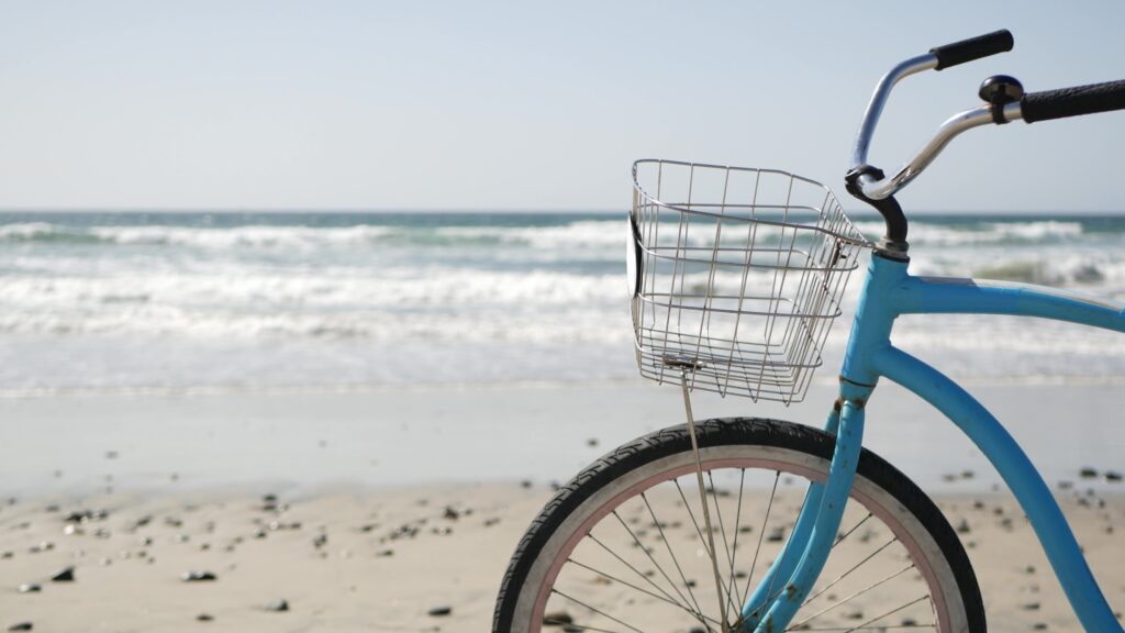 blue beach cruiser on beach