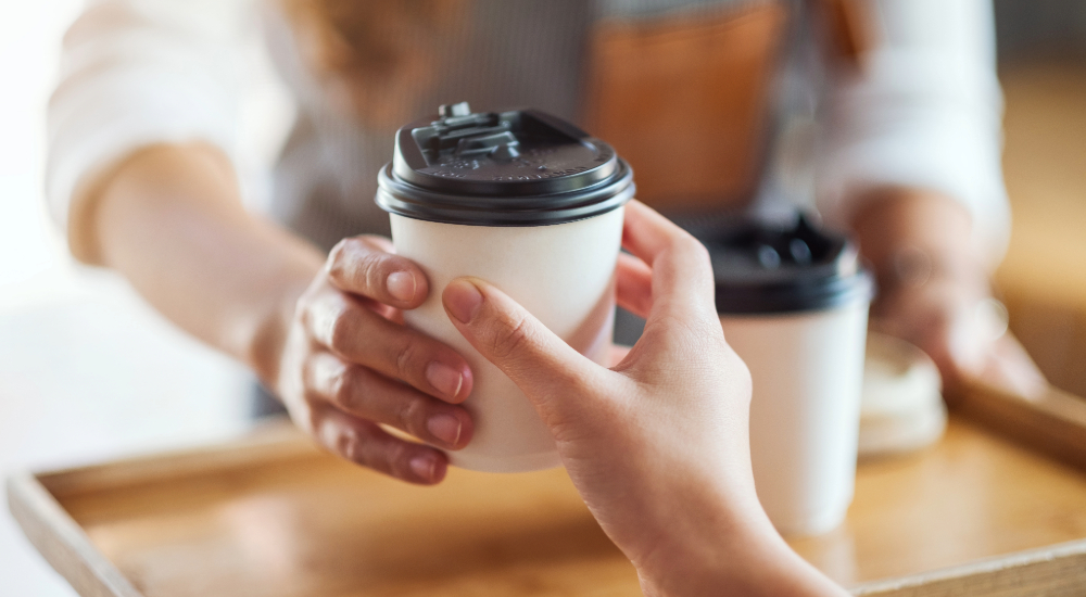 barista serving coffee