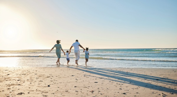 family walking on the beach