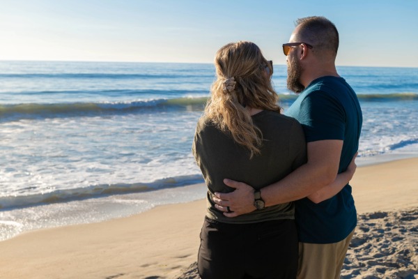 couple hugging on the beach