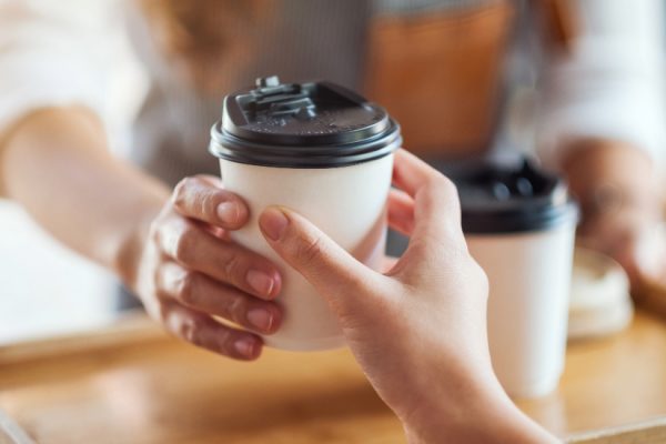 barista serving coffee